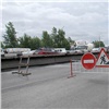 Завершить ремонт Октябрьского моста мешает дождь, заявили подрядчики (фото)